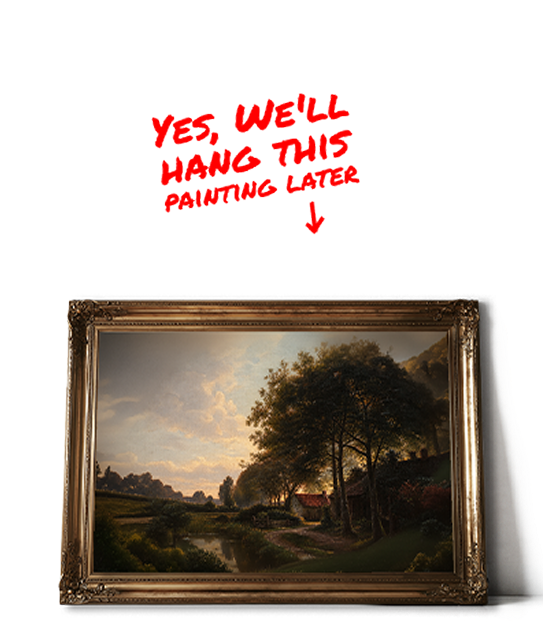 Gilt-framed landscape painting waiting to be hung